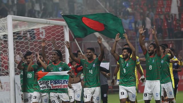 Bishwanath Halder, the lynchpin of the defence, gives a victory lap by waving Palestine flag to the house-full crowd at Bashundhara Kings Arena, who were rejoicing holding the flags of Bangladesh and Palestine
